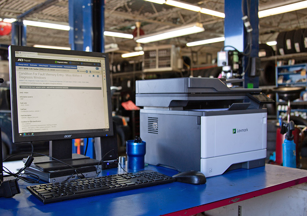 Lexmark Black and White All-in-One 4-series (MB3442i) printer in an auto repair shop.