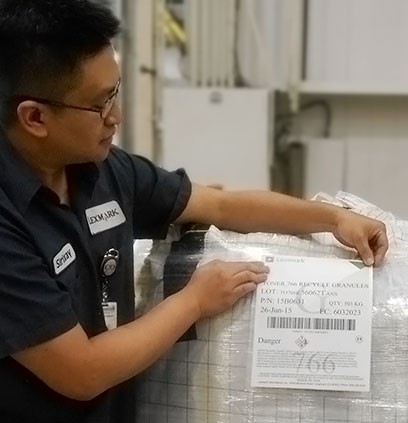 Lexmark employee adding manufacturing label